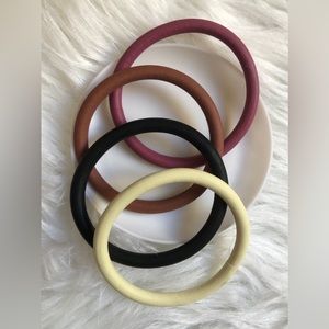 Four stretchy rubber bangle bracelets